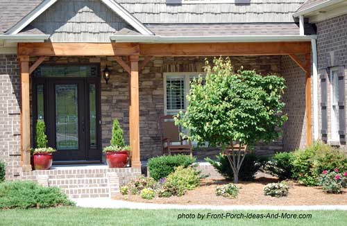 design with a combination gable roof over the entrance and shed roof 