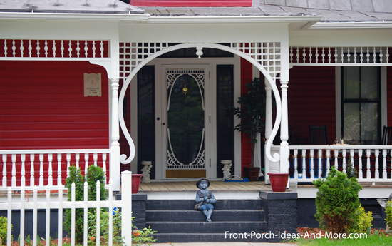 turned porch columns with amazing lattice trim