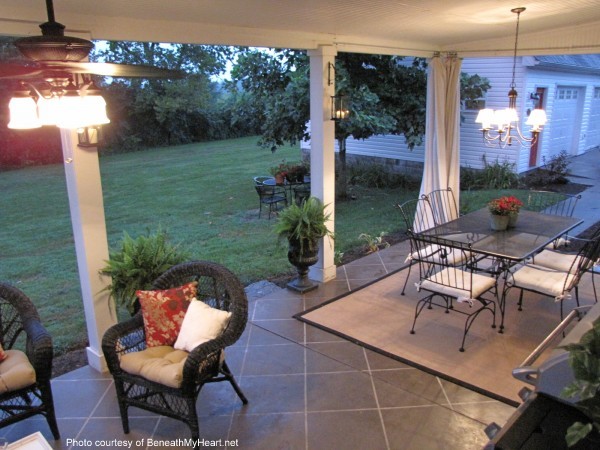 covered patio with furniture and stained concrete floor