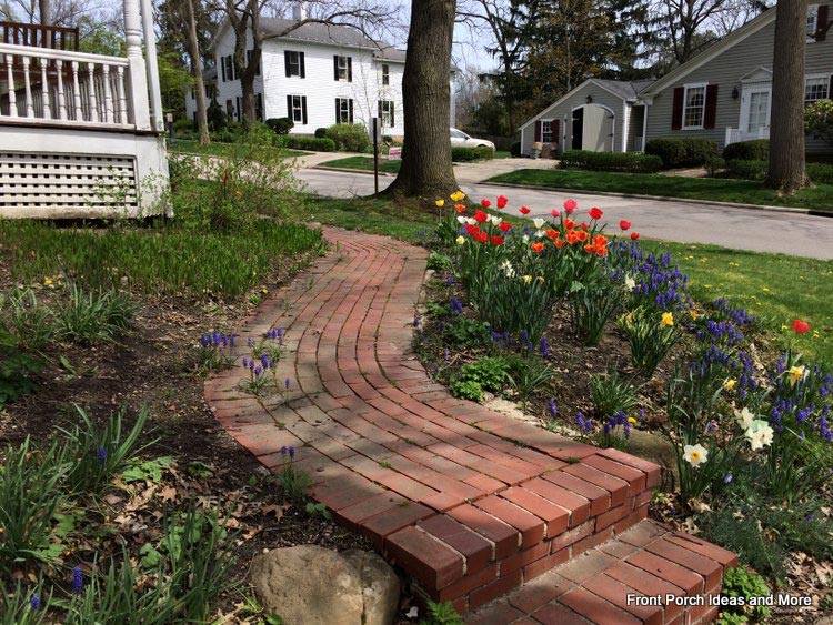 Curved brick walkway leading to porch